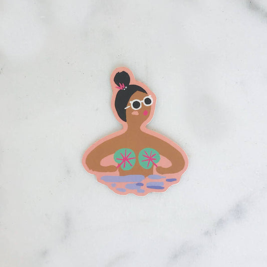 A die-cut sticker featuring a cartoon illustration of a woman relaxing in a bubble bath, wearing round white sunglasses and pink flip-flops, set against a solid light purple background.