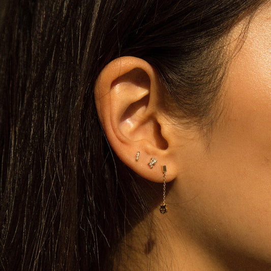 Jennie Kwon Diamond Constellation Stud on dark blue table top