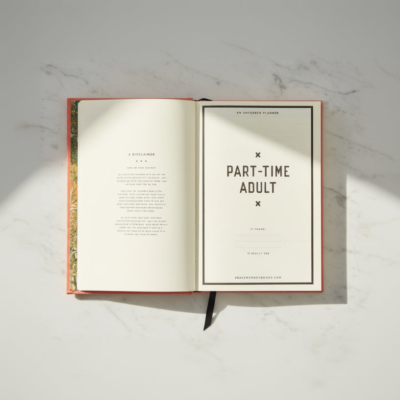 Open planner with 'Part-Time Adult' page on a white marble background