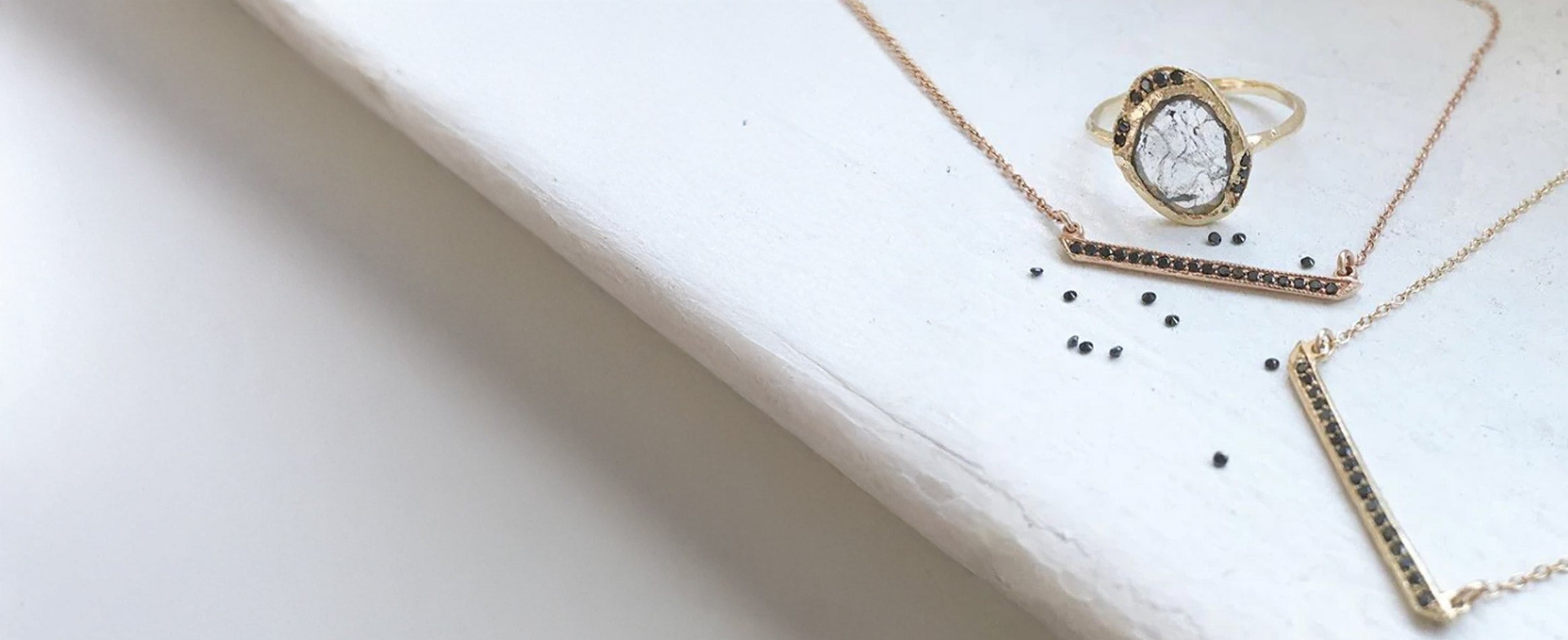 Black diamond necklaces and ring by jewellery designer Misa.