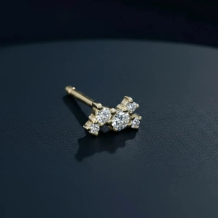 Jennie Kwon Diamond Constellation Stud on dark blue table top