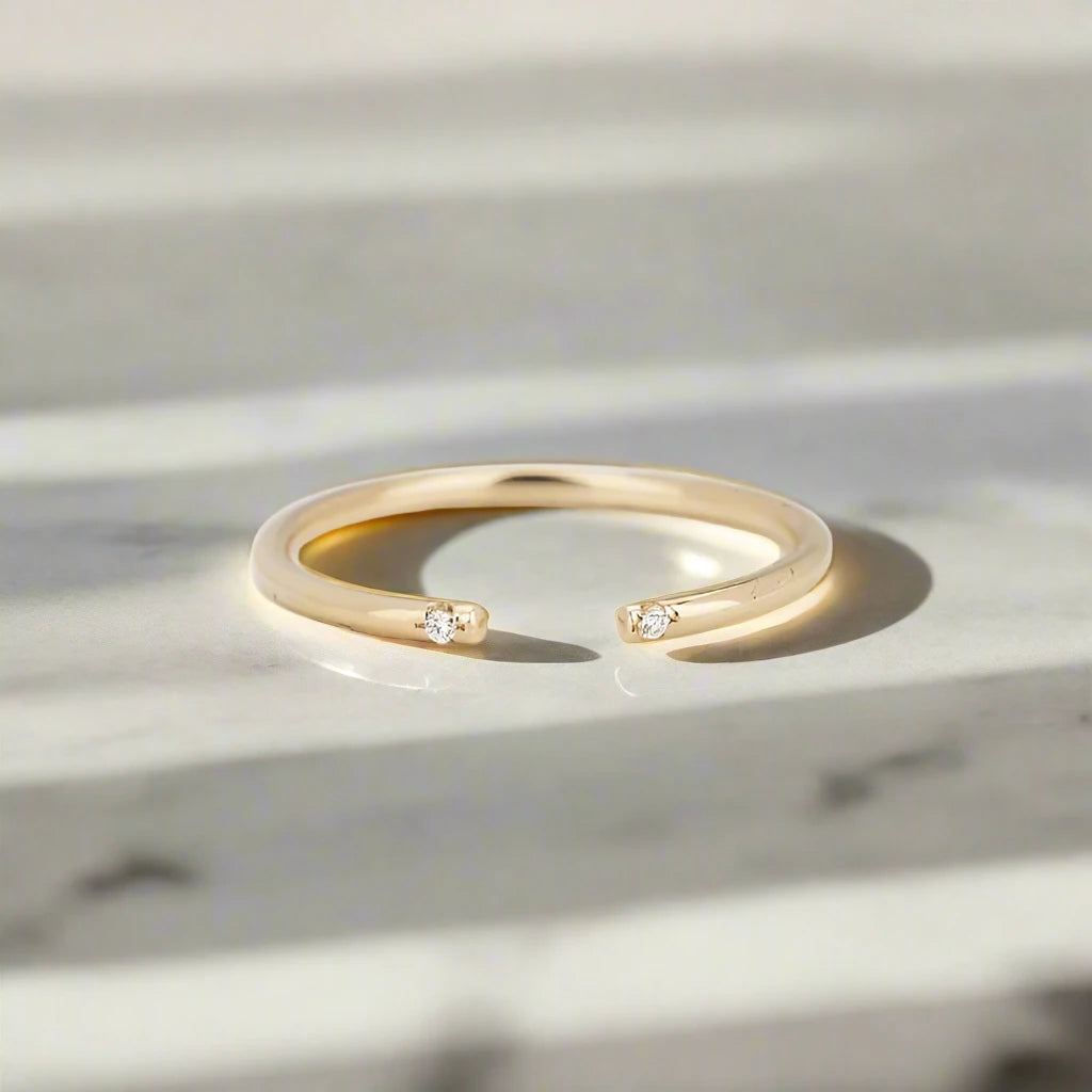 Jennie Kwon White 2 Diamond Cuff Ring on marble table top