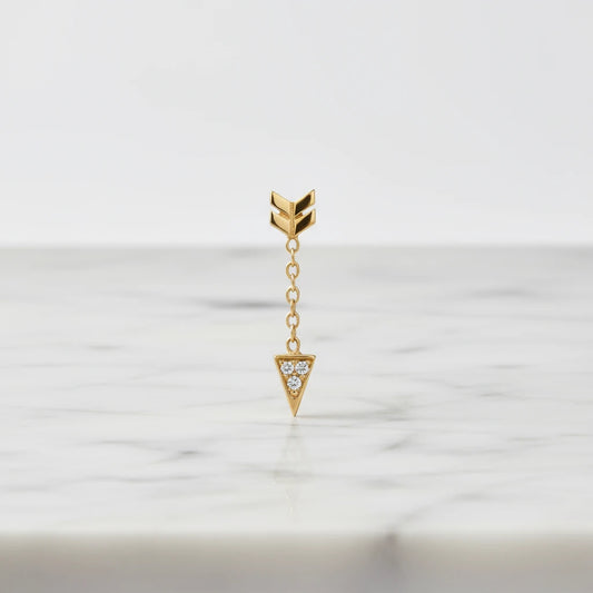 Jennie Kwon Diamond Arrow Earring on white marble table top