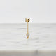 Jennie Kwon Diamond Arrow Earring on white marble table top