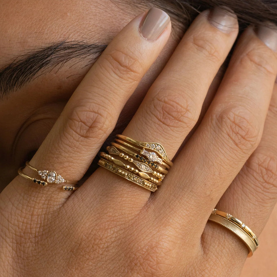 Jennie Kwon Rings stacked on model's hand